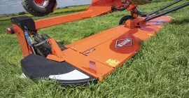 KUHN GMD 5251 TC large-width trailed disc mower on the road