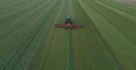 MERGE MAXX 1090 belt merger at work in a field of alfalfa