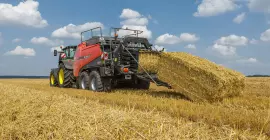 SB 1290 iD baling in a straw field