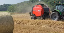KUHN VB 3200 series round baler baling in the field