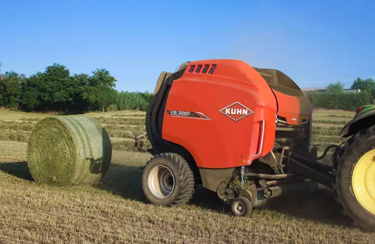 KUHN VB 3200 series round baler baling in the field