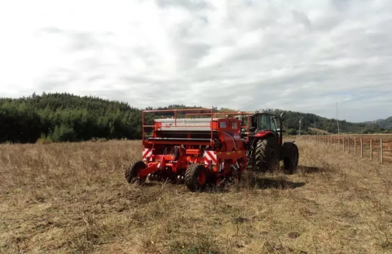 Back view of SDE in working position trailed by tractor