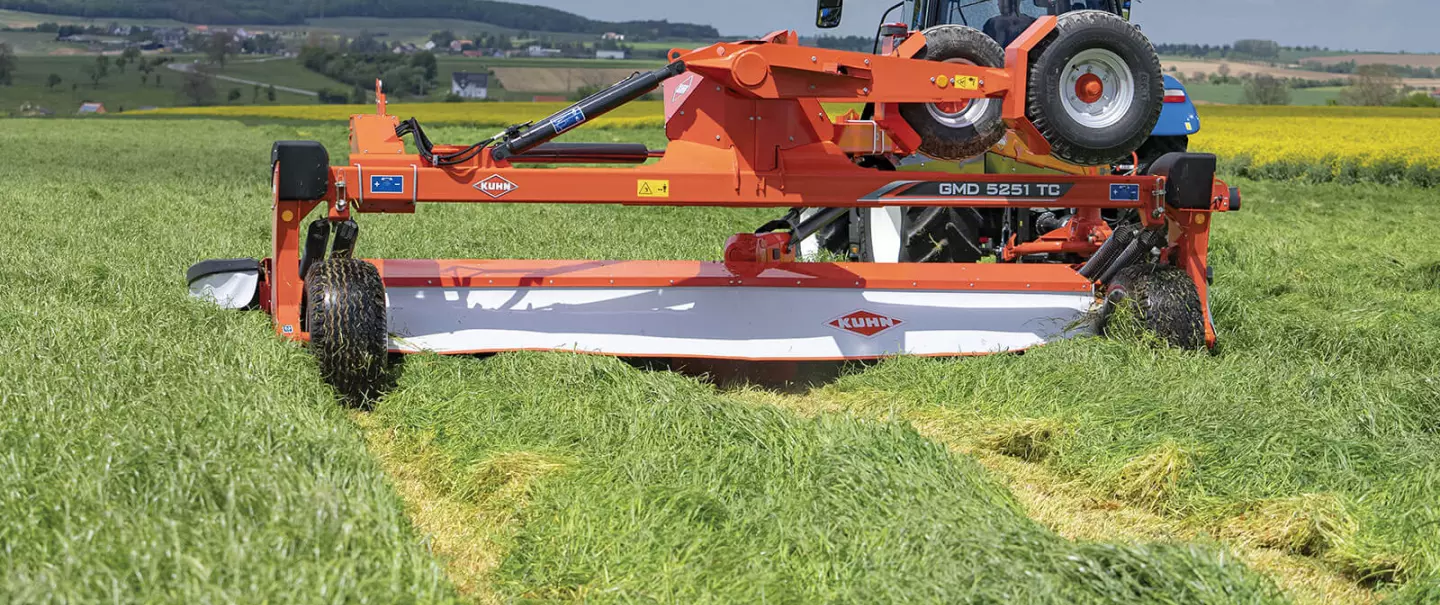 KUHN GMD 5251 TC large-width trailed disc mower on the road