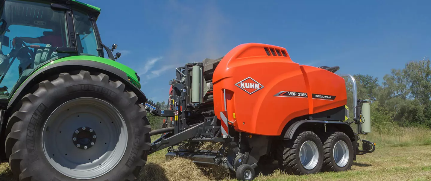 VBP 3165 baler wrapper combination leaving a field with wrapped bales.