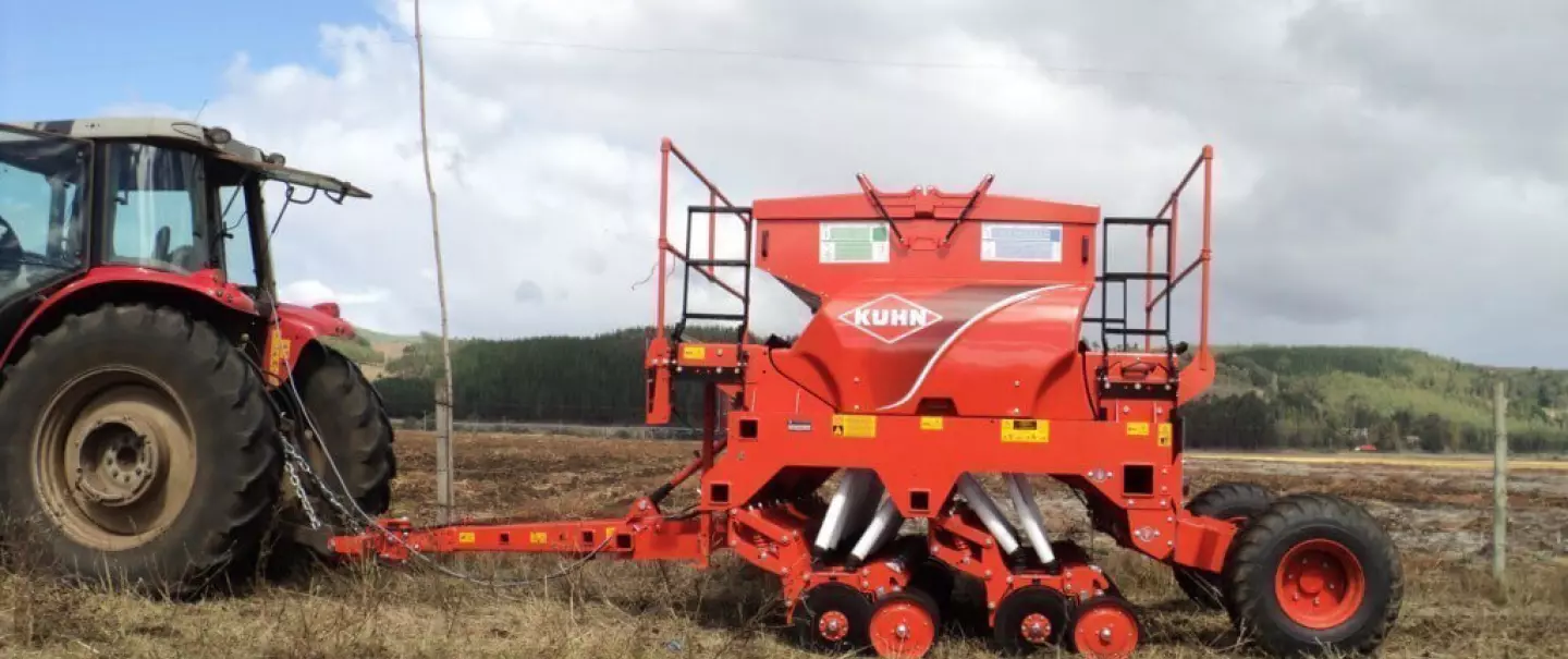 Side view of SDE in working position trailed by tractor