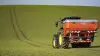 AXIS 50.2 H-EMC-W fertiliser spreader at work