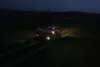 AXIS fertiliser spreader working at night with SpreadLight work lights