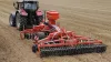 A DISCOVER XM2 equipped with an SH 402 for seeding a crop cover