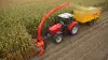 MC180 chopping maize driven by front PTO of a tractor.